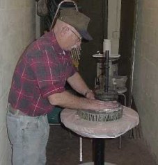 Charlie polishing in the utility closet